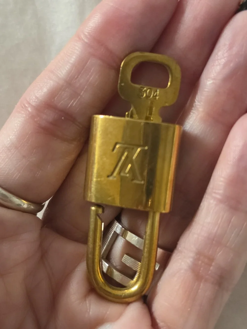 Louis Vuitton Gold-Tone Padlock and Key Set # 304